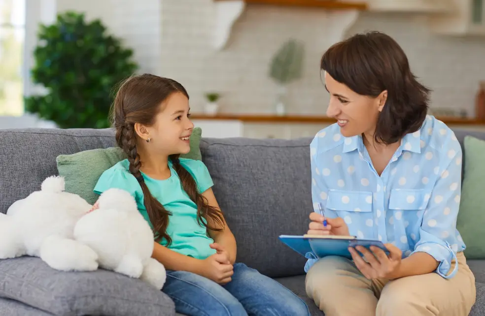 Teacher and student learning on the couch.