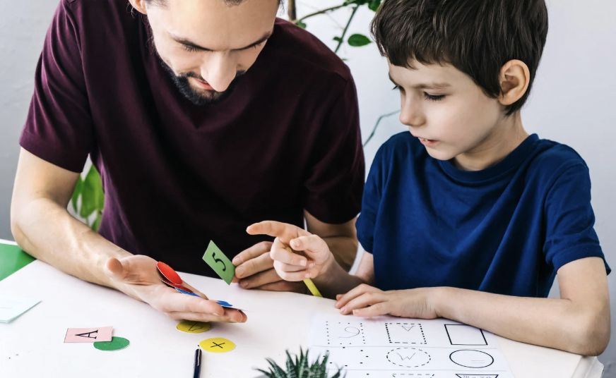child engaging in discrete trial training